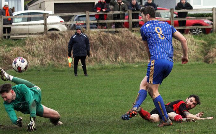 Richard Cope scores the fourth goal for Kilgetty against Tenby. Picture Susan McKehon